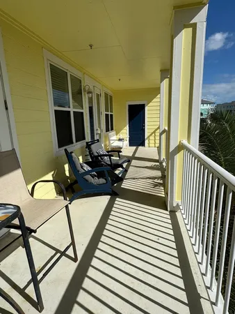 a view of a balcony with chairs