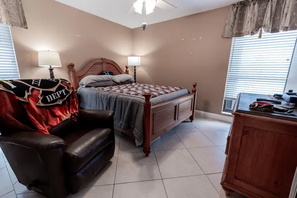 a bedroom with a bed and a dresser