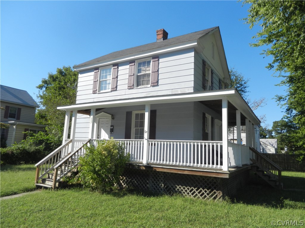 1007 Burnside Street Hopewell, VA 23860 - Photo 17 of 19 a front view of a house with a garden