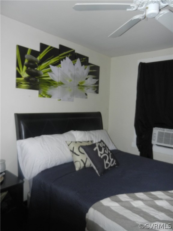1007 Burnside Street Hopewell, VA 23860 - Photo 10 of 19 a bedroom with a bed and a painting on the wall