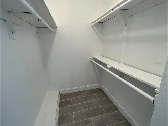 a view of a room with racks on the wall