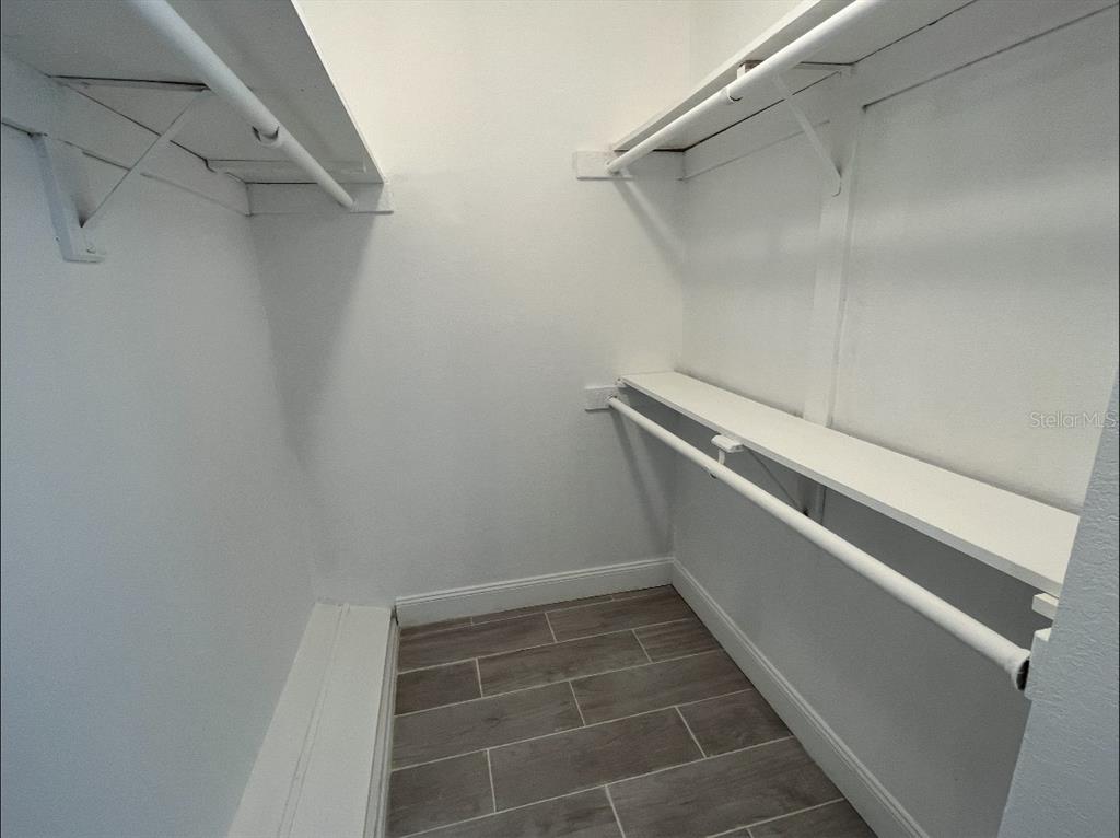 2526 Lemon Tree Lane, Unit L Orlando, FL 32839 - Photo 14 of 16 a view of a room with racks on the wall