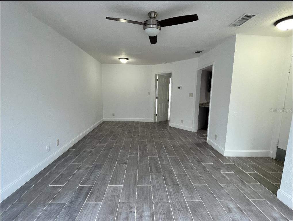 2526 Lemon Tree Lane, Unit L Orlando, FL 32839 - Photo 5 of 16 a view of a room with wooden floor