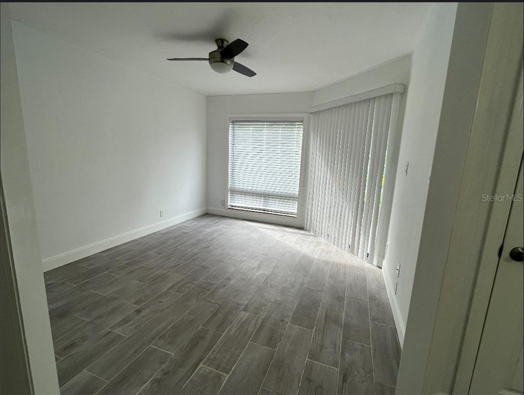 2526 Lemon Tree Lane, Unit L Orlando, FL 32839 - Photo 10 of 16 a view of an empty room with a window