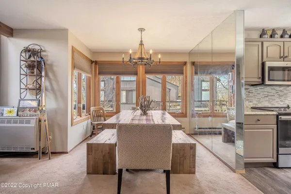a kitchen with a table and chairs