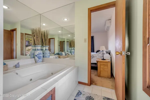 a bedroom with a bed and a walk in closet