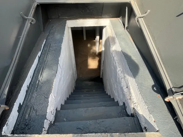 a bathroom with a shower and a sink