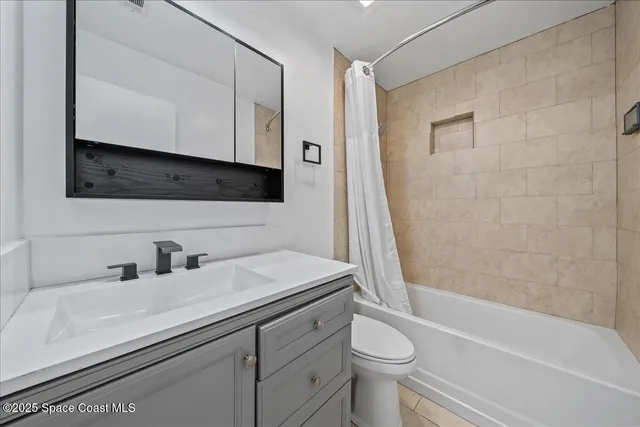 a bathroom with a sink a toilet and a bathtub