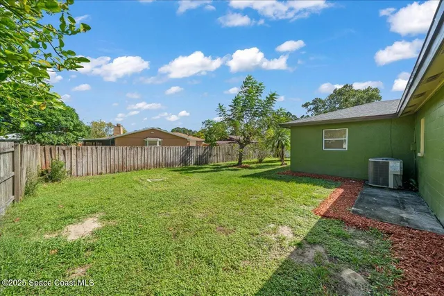 a view of a backyard with a garden