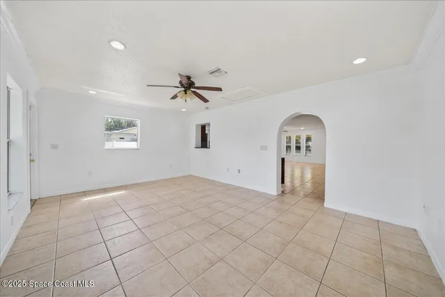 a view of empty room with windows