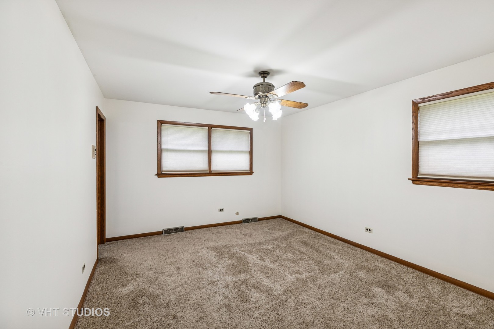 452 Miller Street Beecher, IL 60401 - Photo 8 of 20 an empty room with windows and chandelier fan