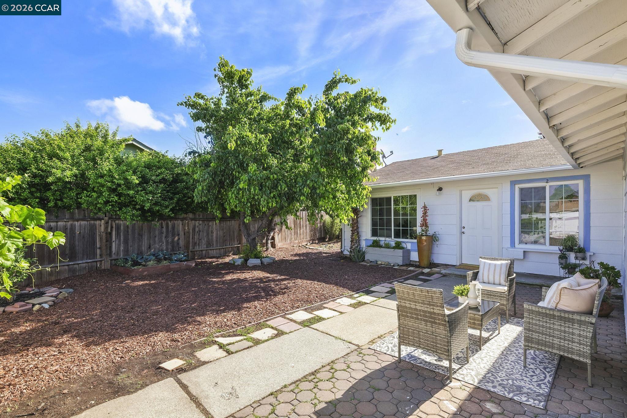 476 Pamela Drive Bay Point, CA 94565 - Photo 1 of 24 a view of a backyard with plants and a patio