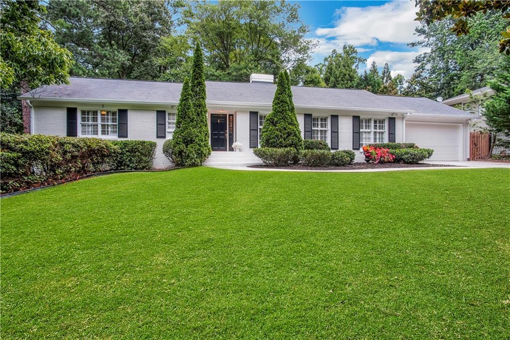 956 Ferncliff Road Northeast Atlanta, GA 30324 - Photo 1 of 1 a front view of a house with a garden and porch