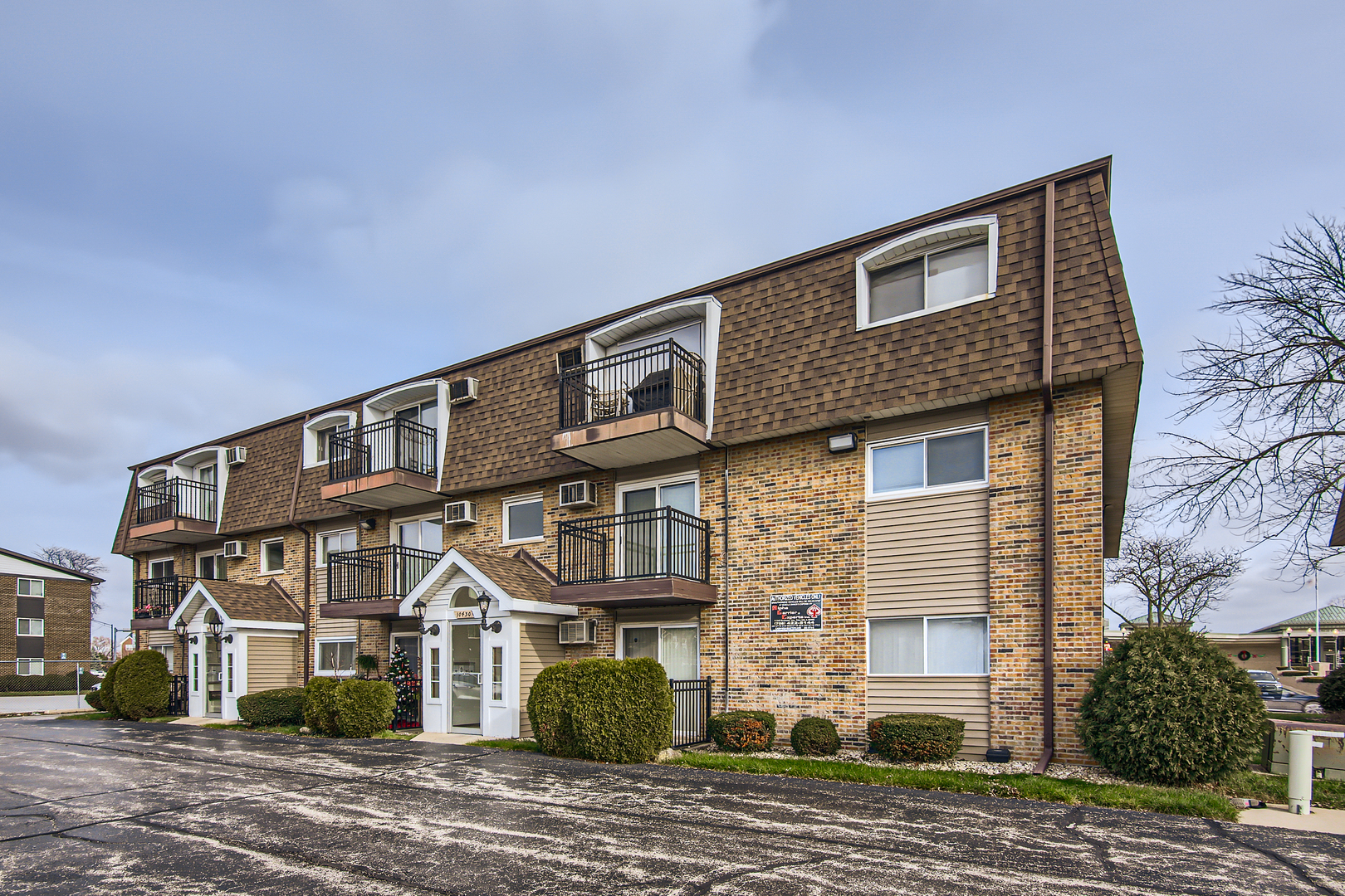 10430 Ridgeland Avenue, Unit 12 Chicago Ridge, IL 60415 - Photo 11 of 11 a front view of a house with a yard