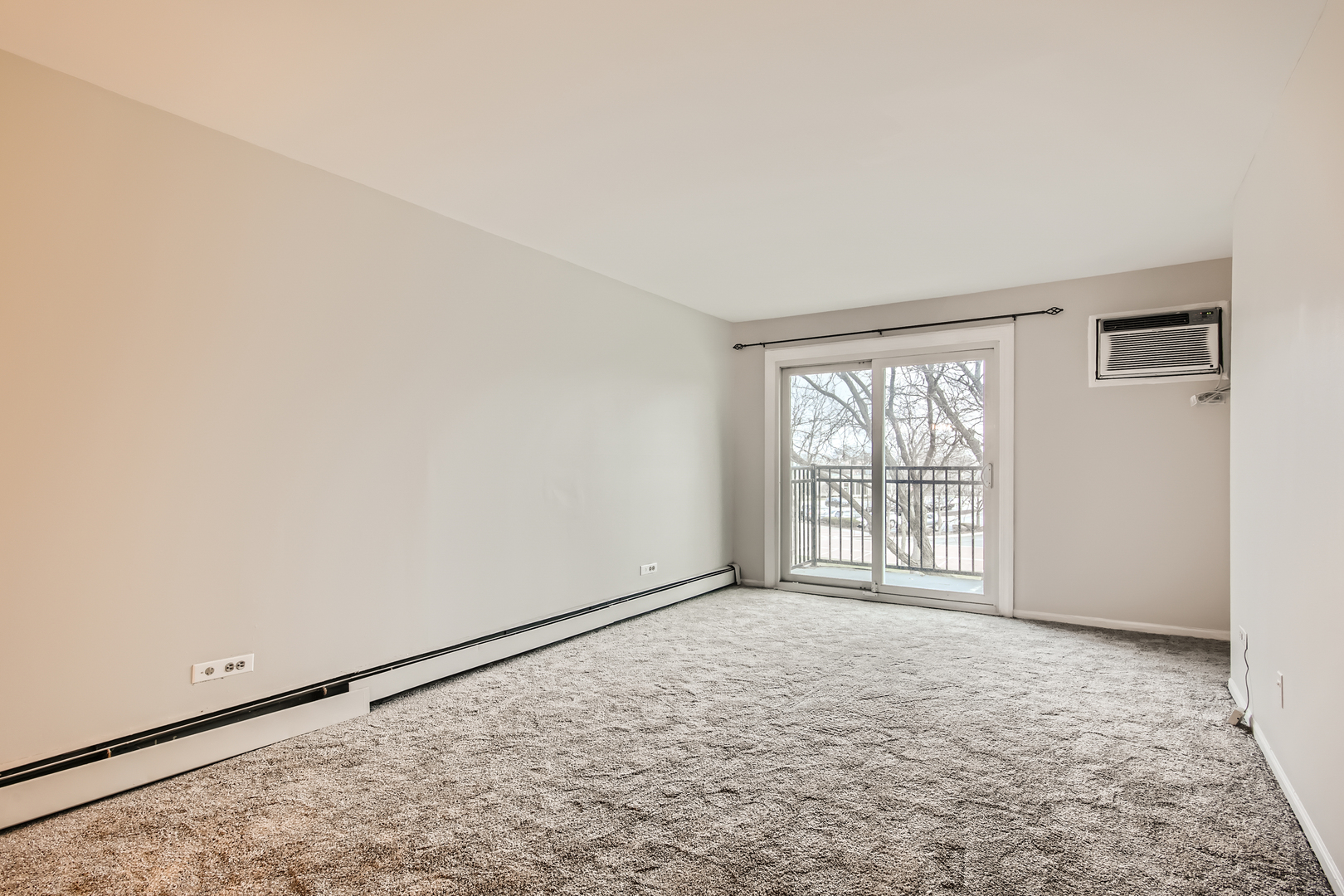 10430 Ridgeland Avenue, Unit 12 Chicago Ridge, IL 60415 - Photo 2 of 11 wooden floor in an empty room with a window