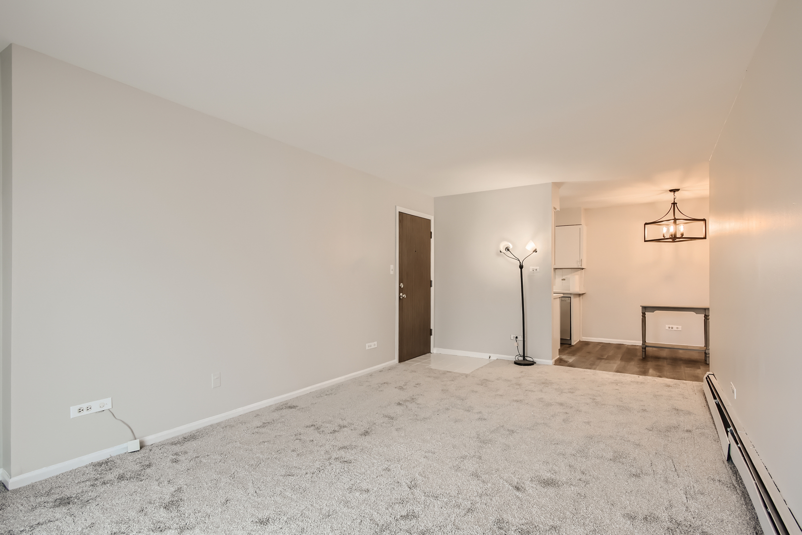 10430 Ridgeland Avenue, Unit 12 Chicago Ridge, IL 60415 - Photo 3 of 11 a view of a big room with a refrigerator