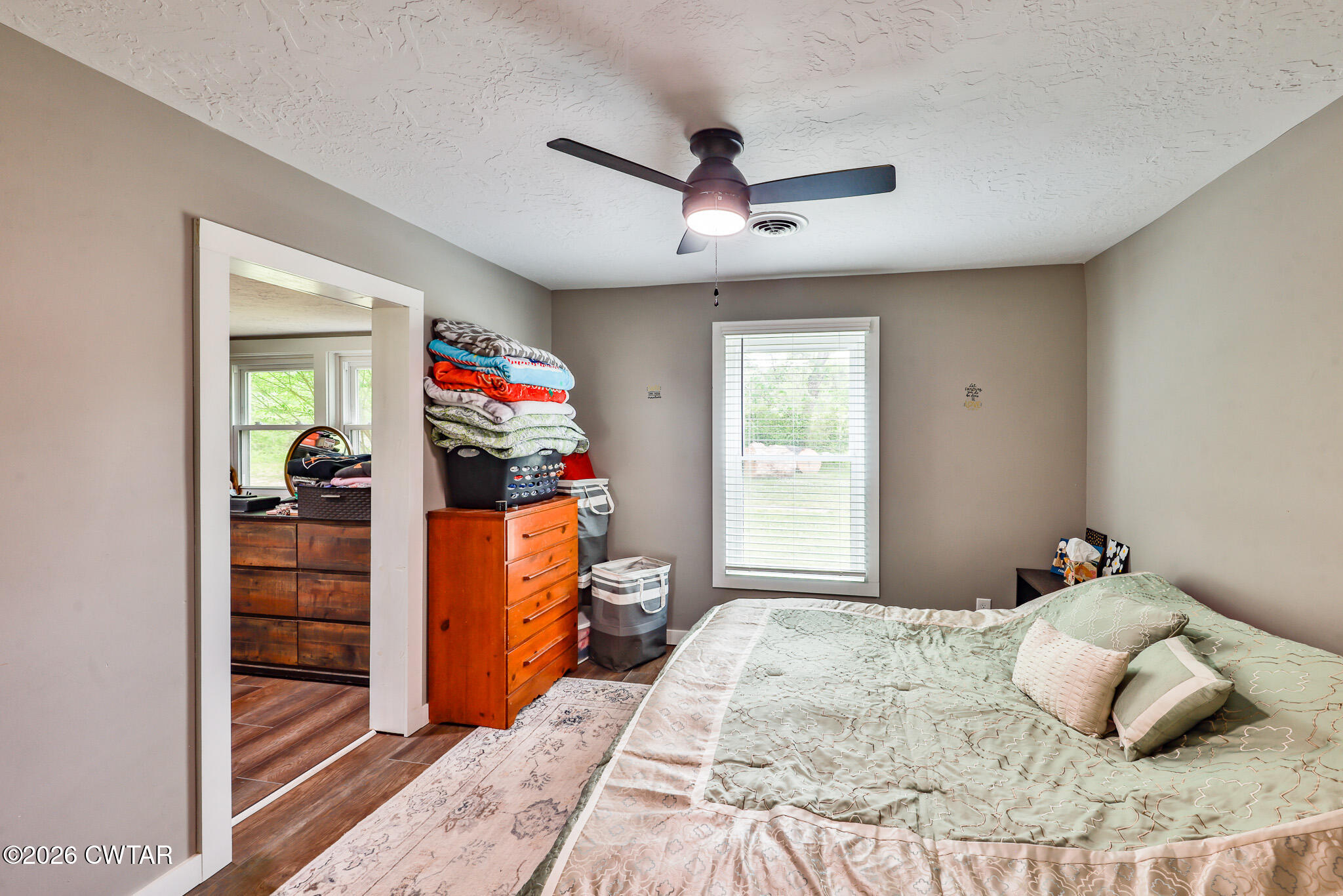 210 East Union Street Gleason, TN 38229 - Photo 11 of 28 a bedroom with a bed and a dresser