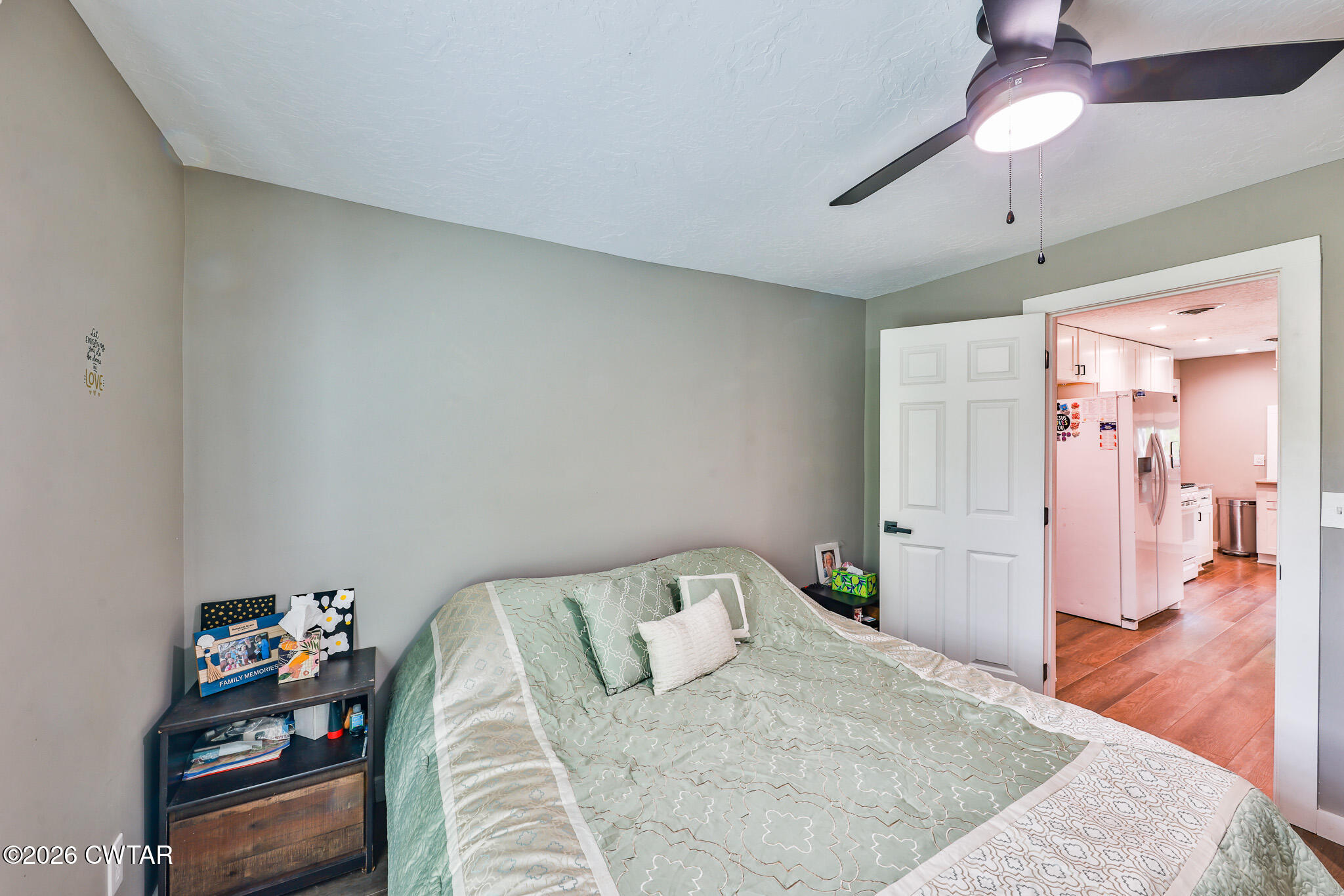 210 East Union Street Gleason, TN 38229 - Photo 12 of 28 a bedroom with a bed and a wooden floor
