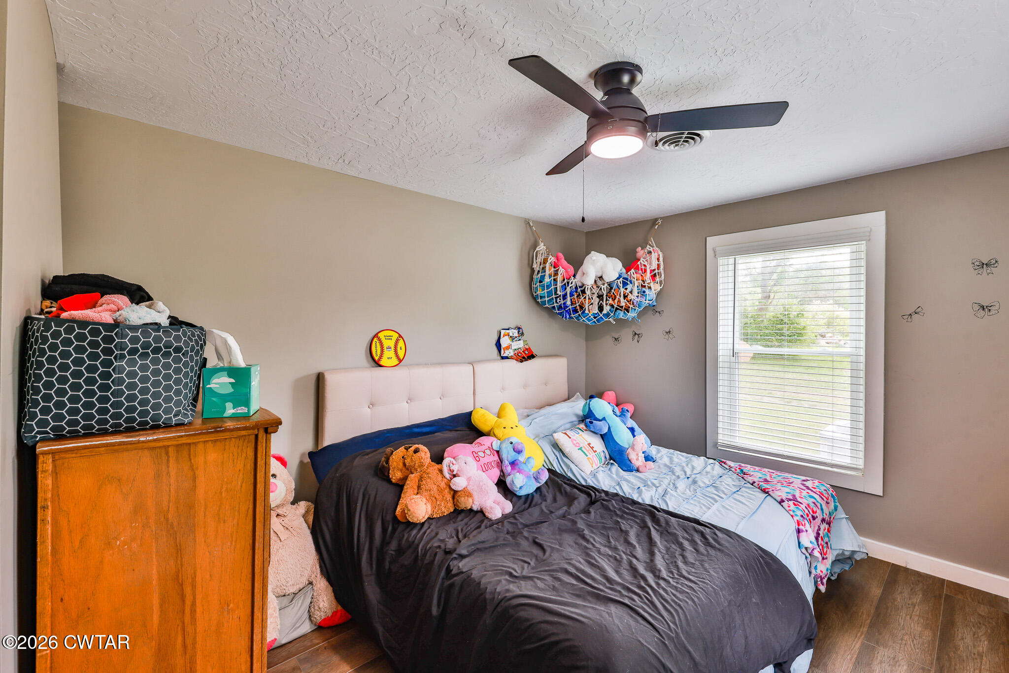 210 East Union Street Gleason, TN 38229 - Photo 16 of 28 a bedroom with a bed a window and dresser