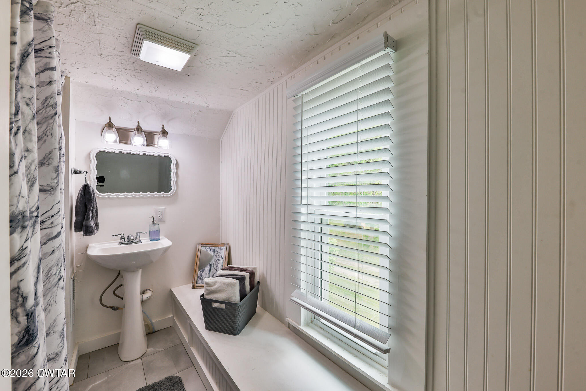 210 East Union Street Gleason, TN 38229 - Photo 19 of 28 a bathroom with a toilet sink and mirror