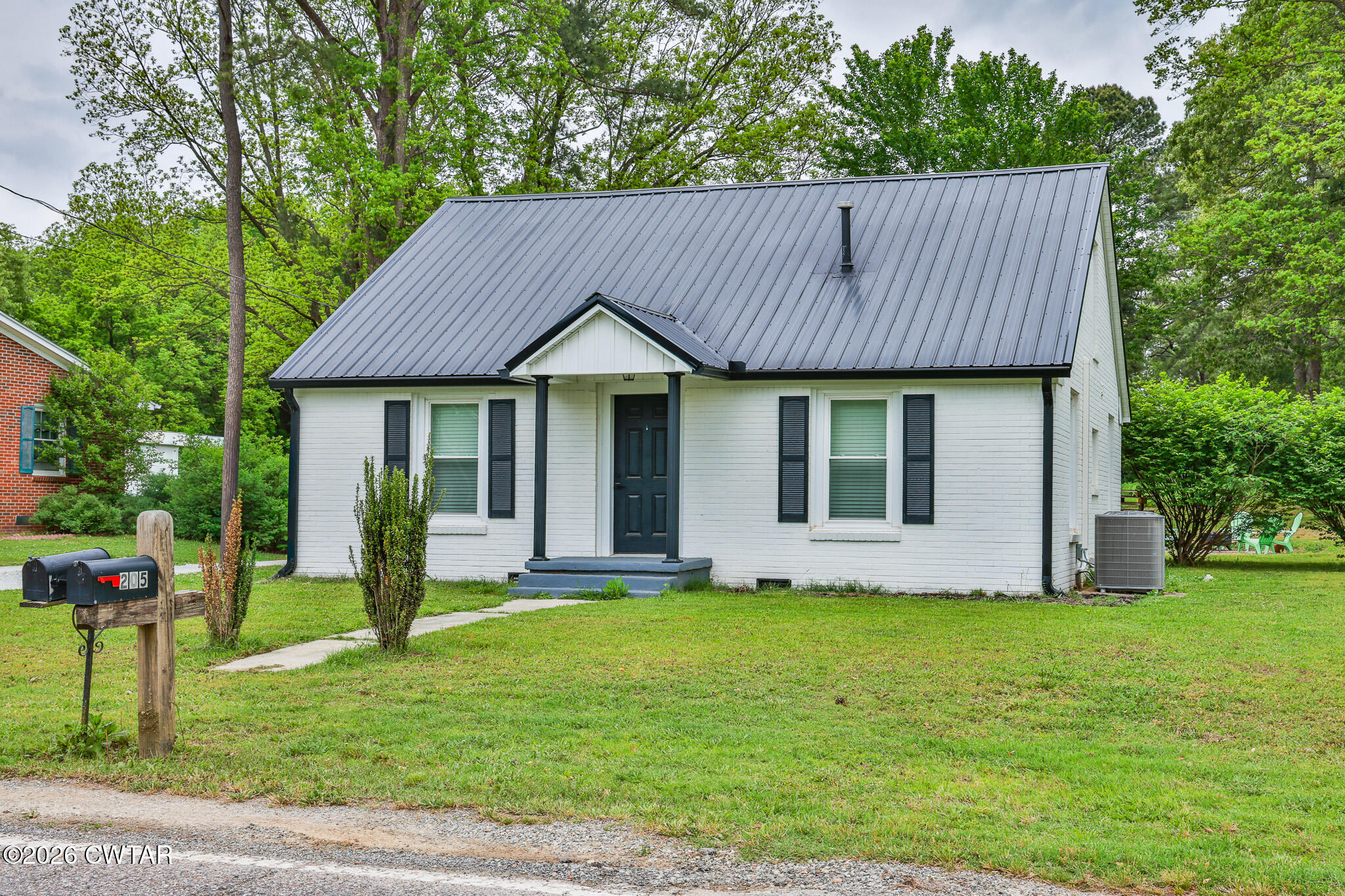 210 East Union Street Gleason, TN 38229 - Photo 2 of 28 a front view of a house with a yard