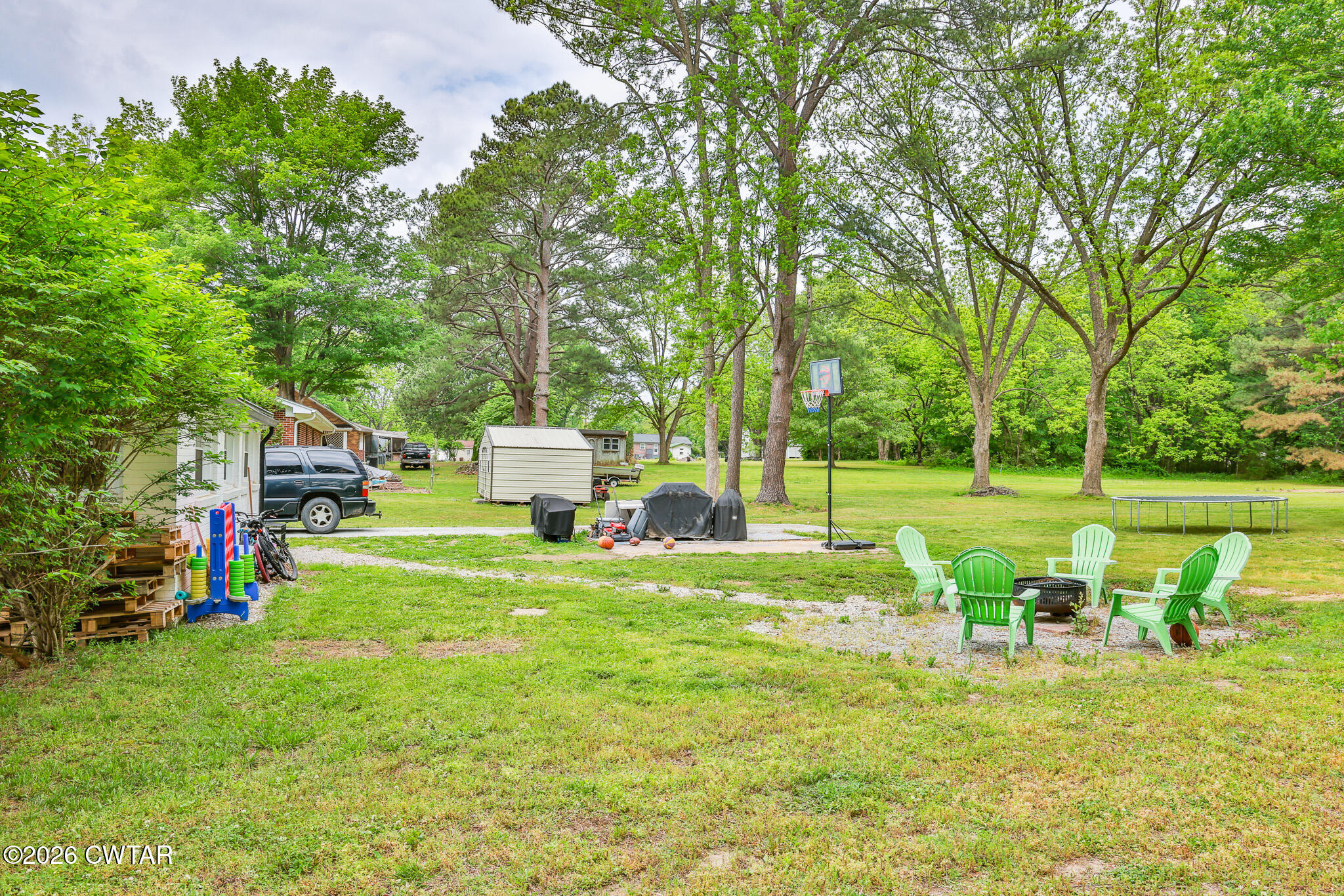 210 East Union Street Gleason, TN 38229 - Photo 24 of 28 a view of a house with pool and a big yard