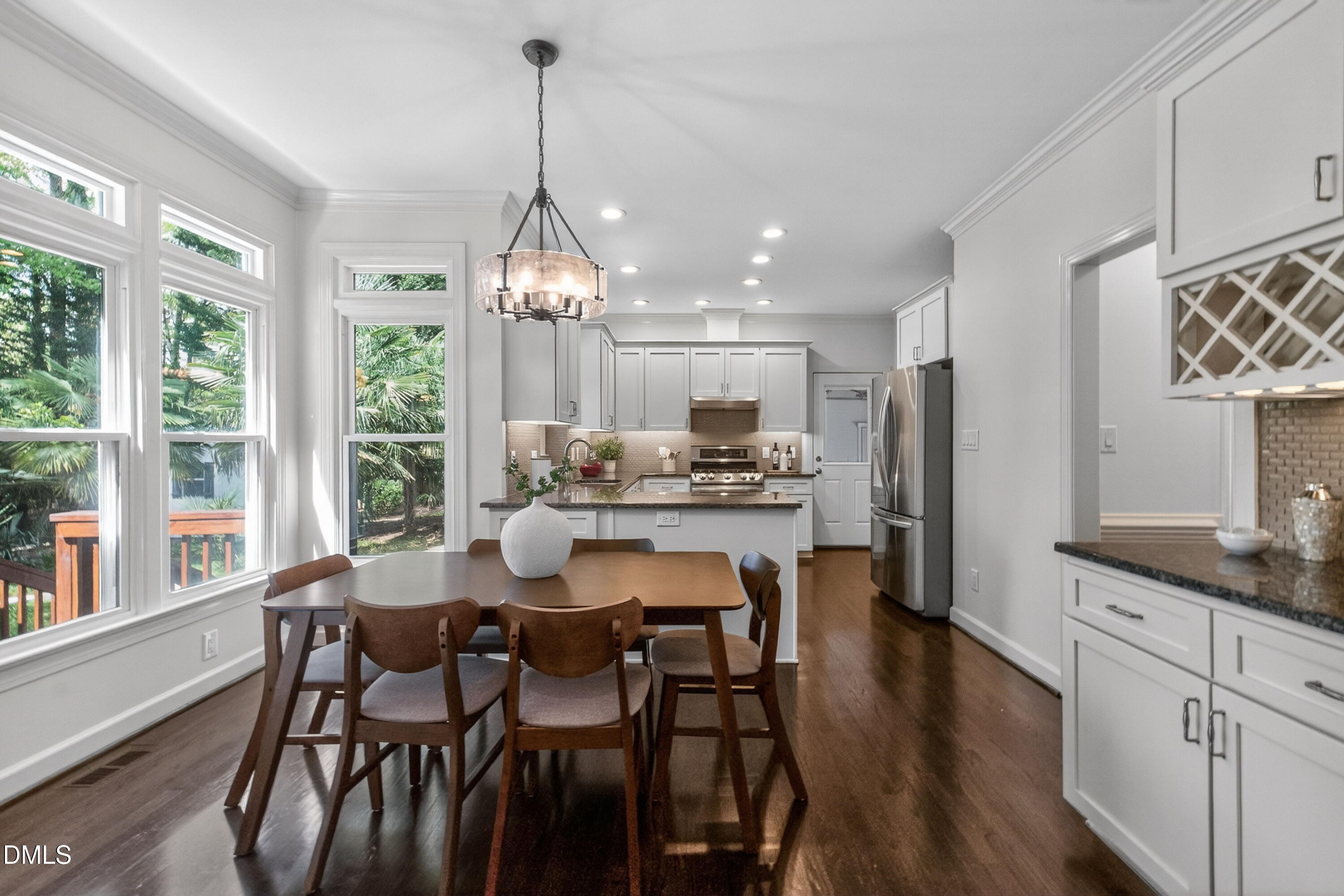 4021 Westwood Place Raleigh, NC 27613 - Photo 11 of 37 a dining room filled chandelier and wooden floor