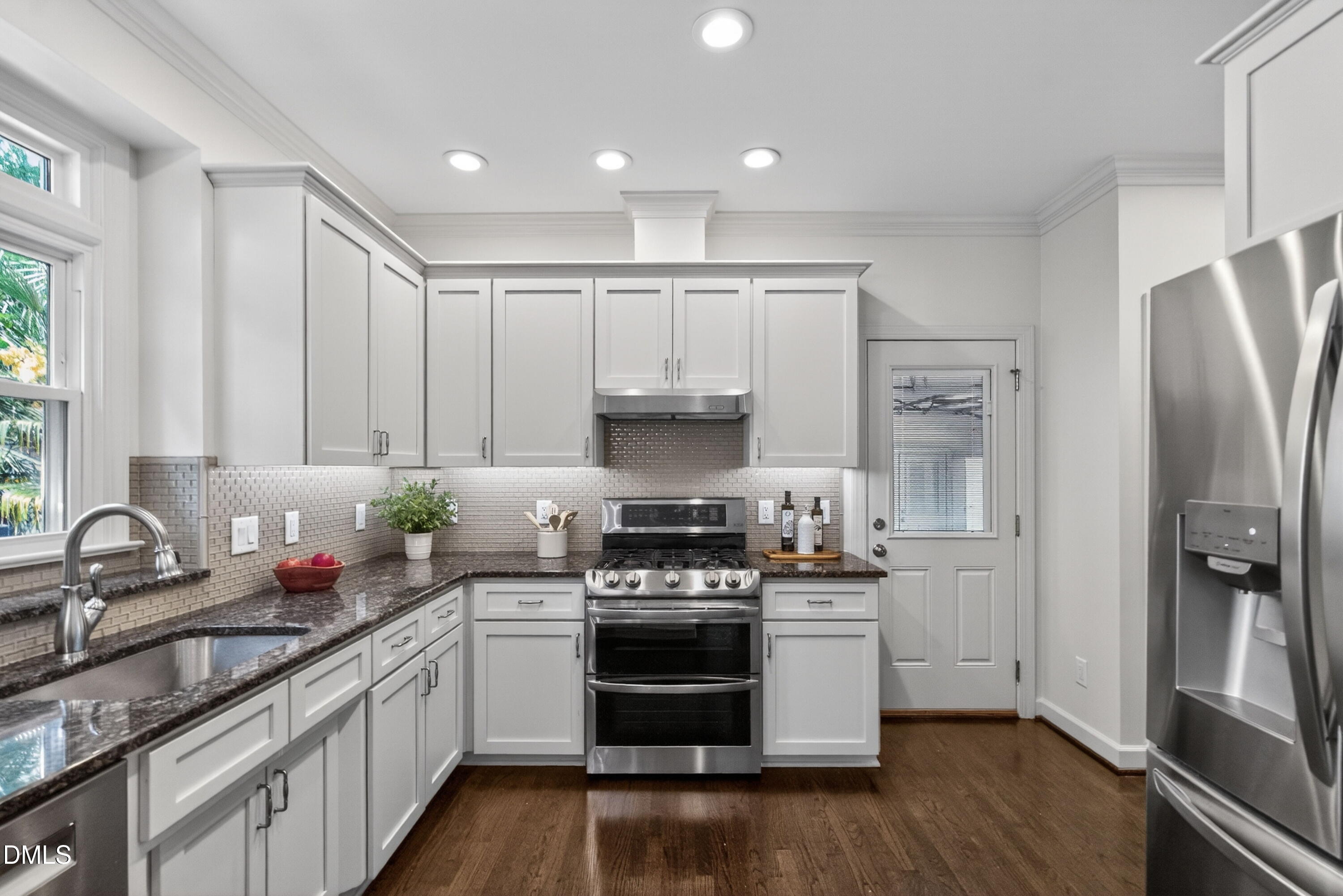 4021 Westwood Place Raleigh, NC 27613 - Photo 12 of 37 a kitchen with a sink stove and refrigerator