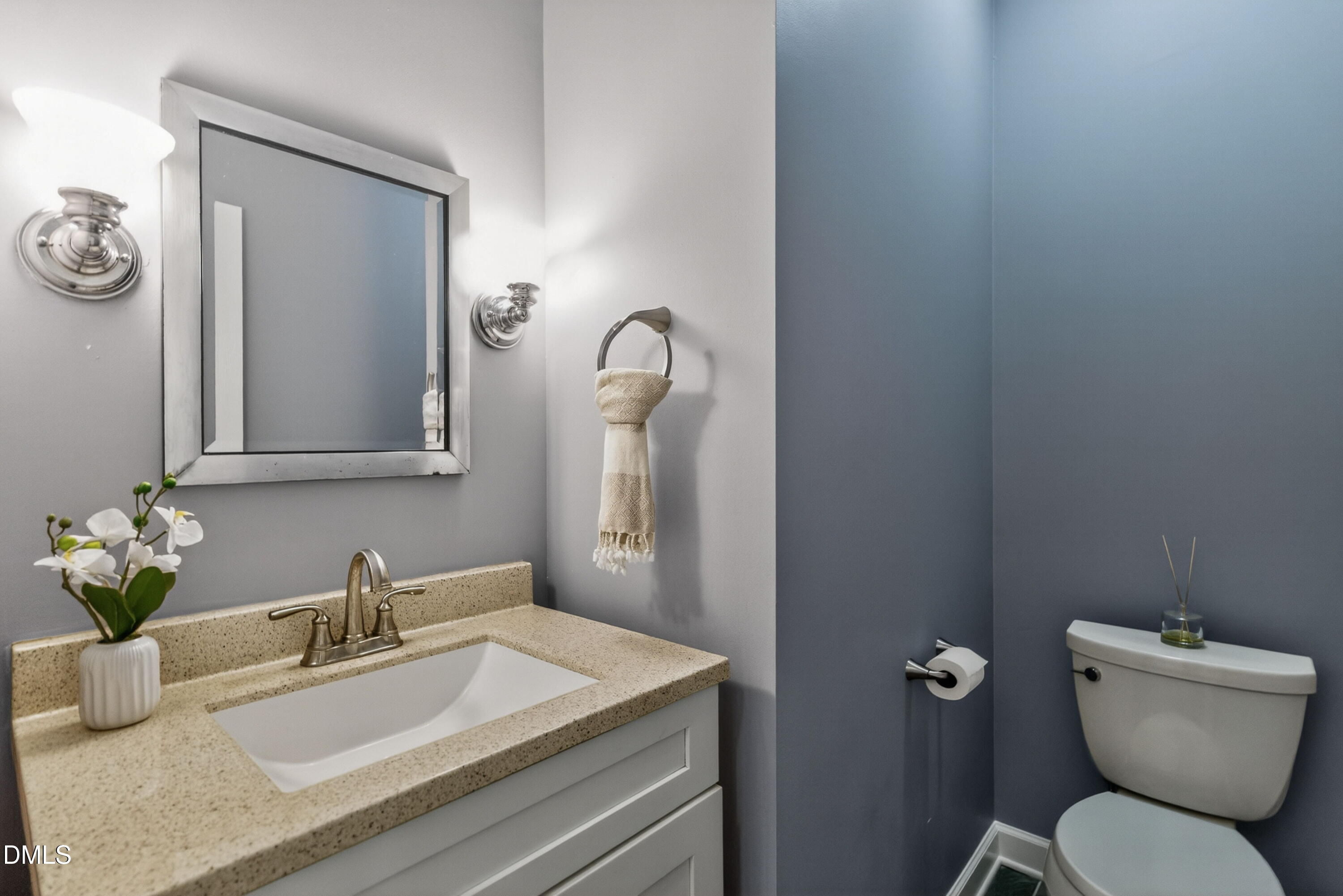 4021 Westwood Place Raleigh, NC 27613 - Photo 16 of 37 a bathroom with a toilet sink and mirror