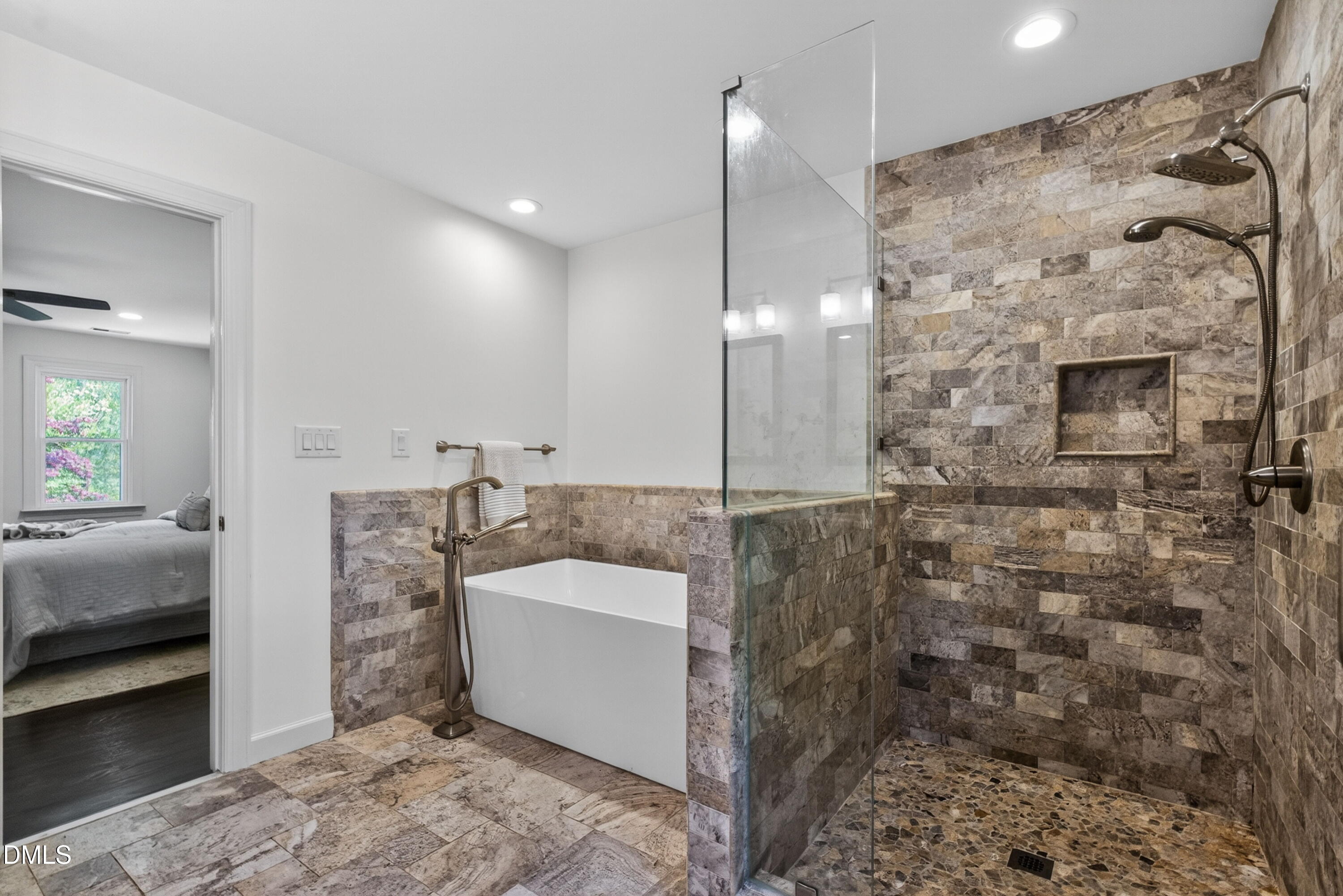 4021 Westwood Place Raleigh, NC 27613 - Photo 19 of 37 a spacious bathroom with a shower sink and mirror