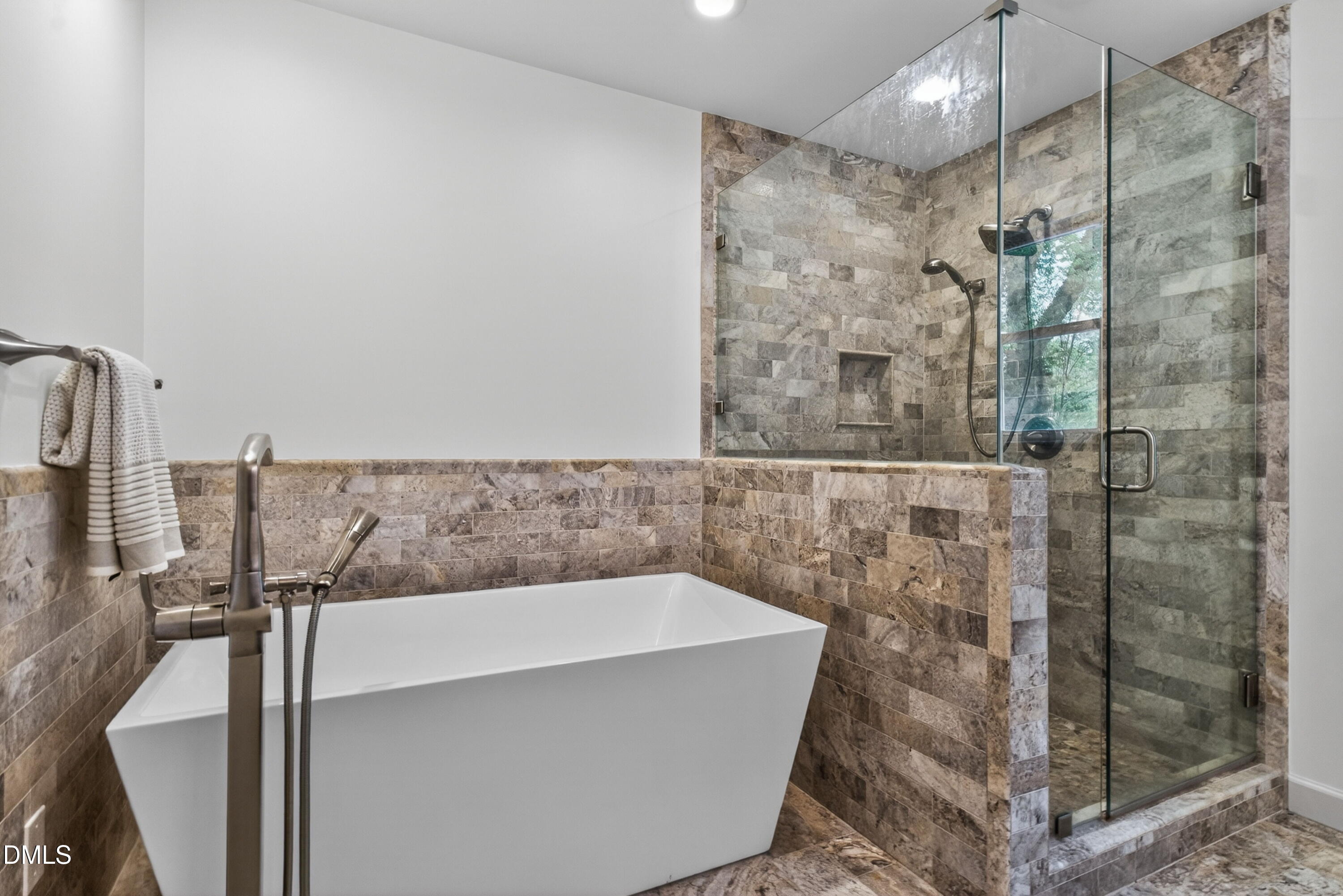 4021 Westwood Place Raleigh, NC 27613 - Photo 20 of 37 a bathroom with a bathtub and shower