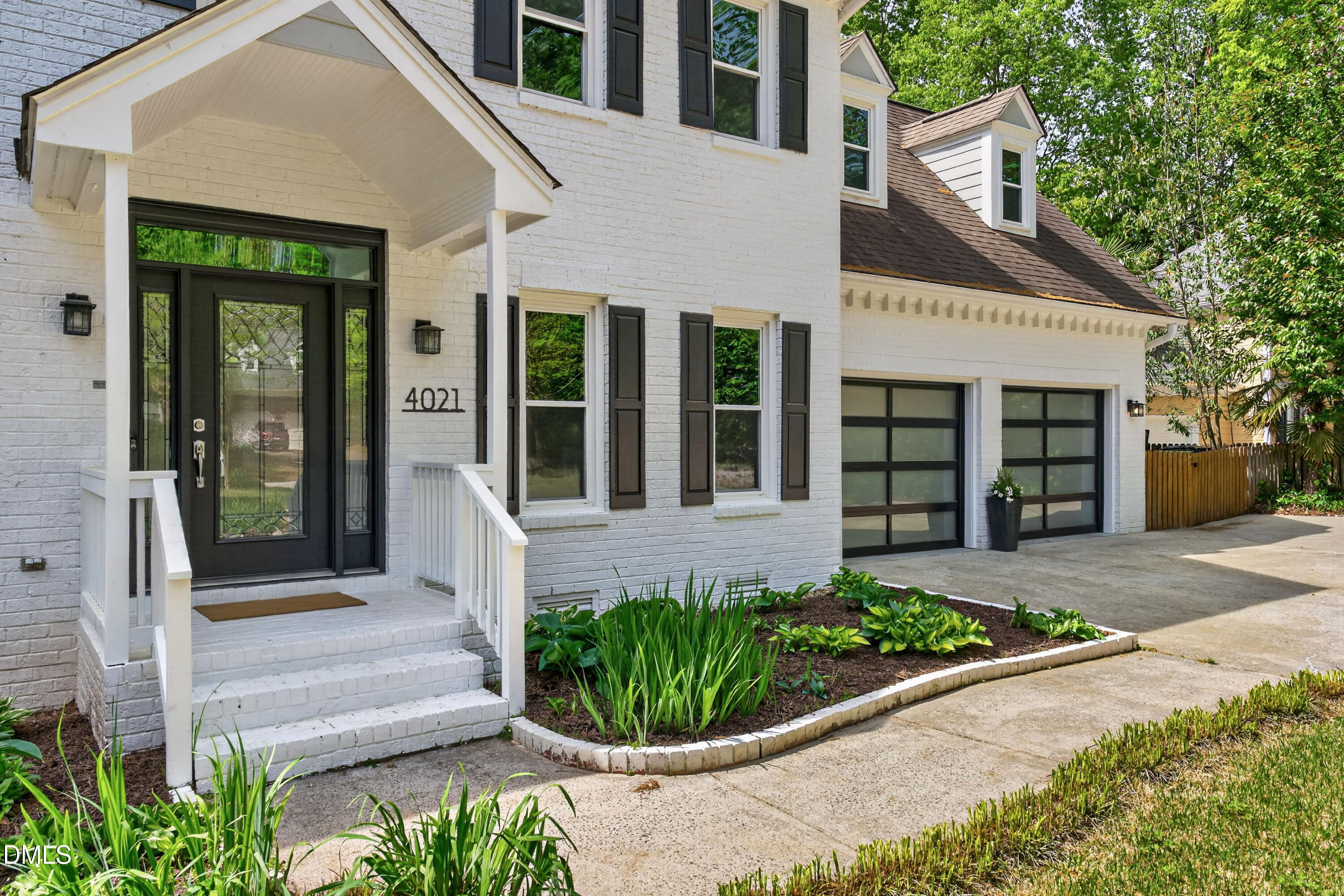 4021 Westwood Place Raleigh, NC 27613 - Photo 2 of 37 a front view of a house with a yard