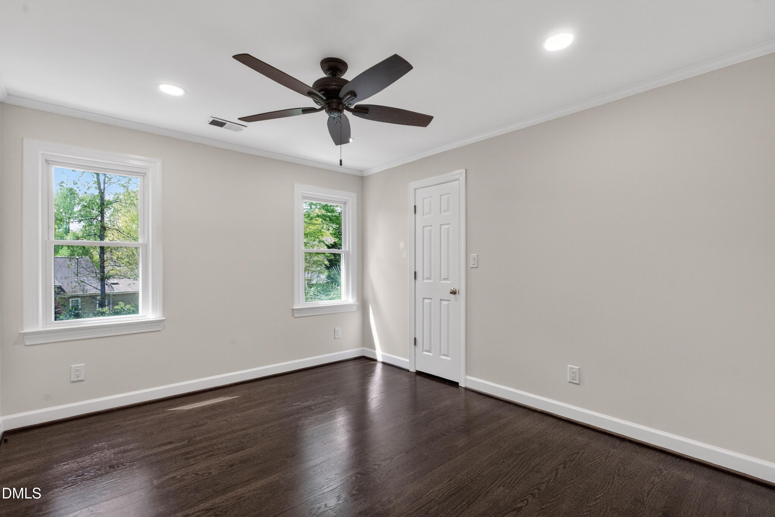 4021 Westwood Place Raleigh, NC 27613 - Photo 21 of 37 a view of an empty room with wooden floor and window