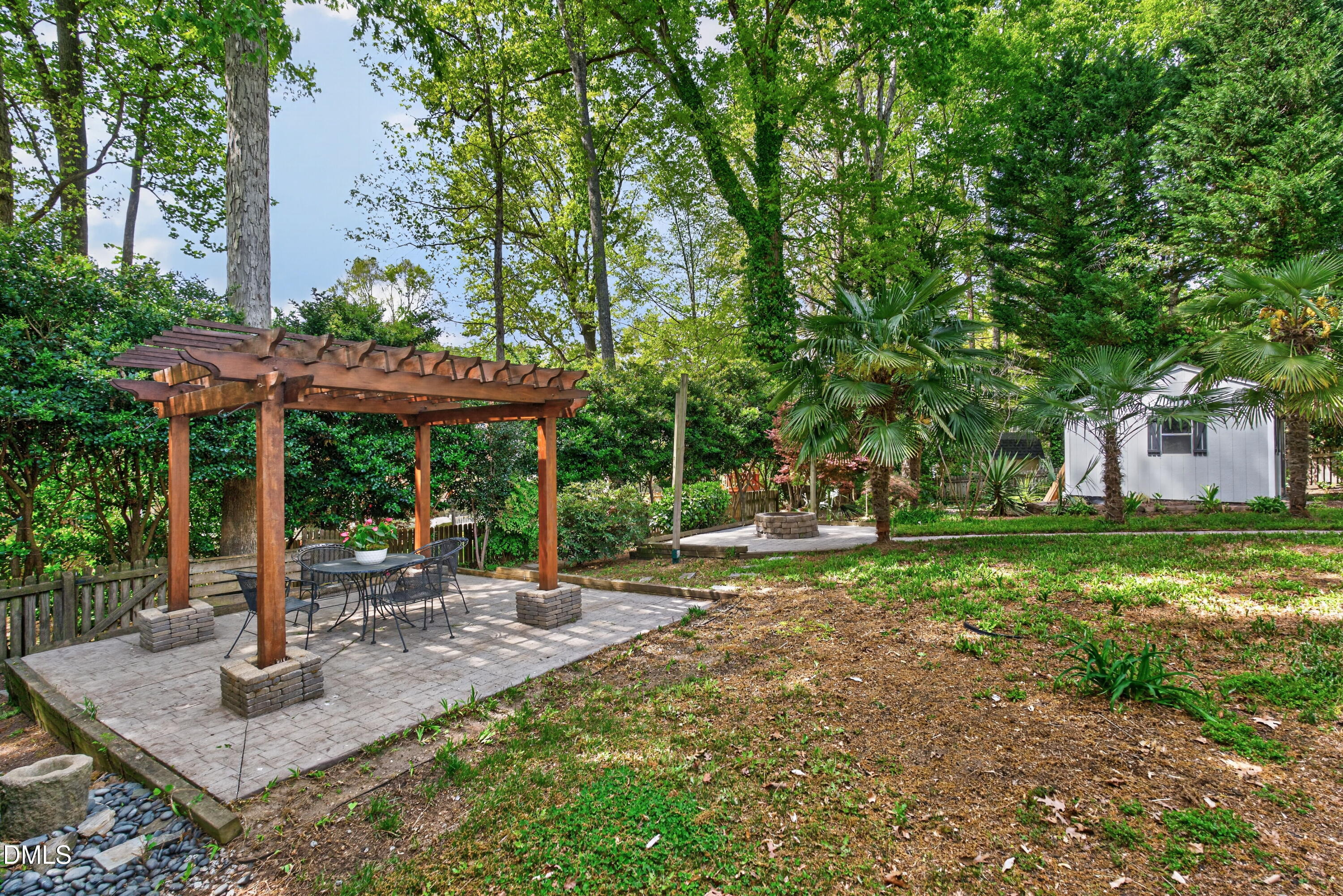 4021 Westwood Place Raleigh, NC 27613 - Photo 34 of 37 a backyard of a house with table and chairs