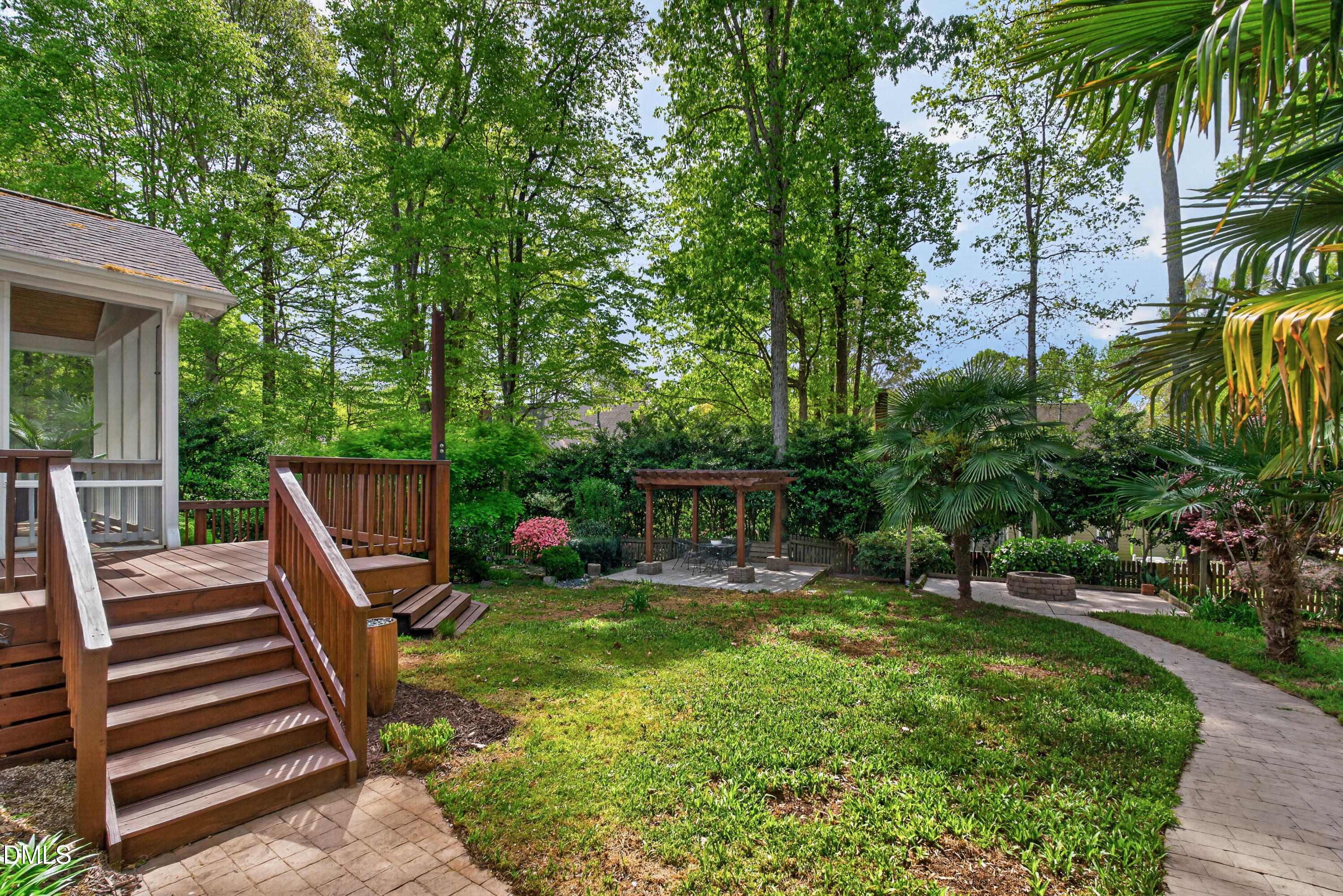 4021 Westwood Place Raleigh, NC 27613 - Photo 36 of 37 a view of a house with backyard wooden deck and sitting area