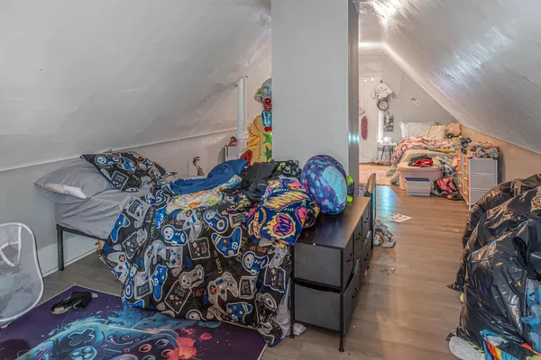 a bedroom with furniture and a bed
