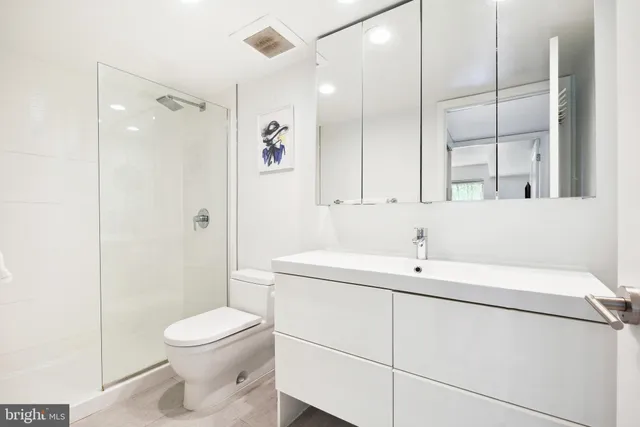 a bedroom with a bed and a flat tv screen