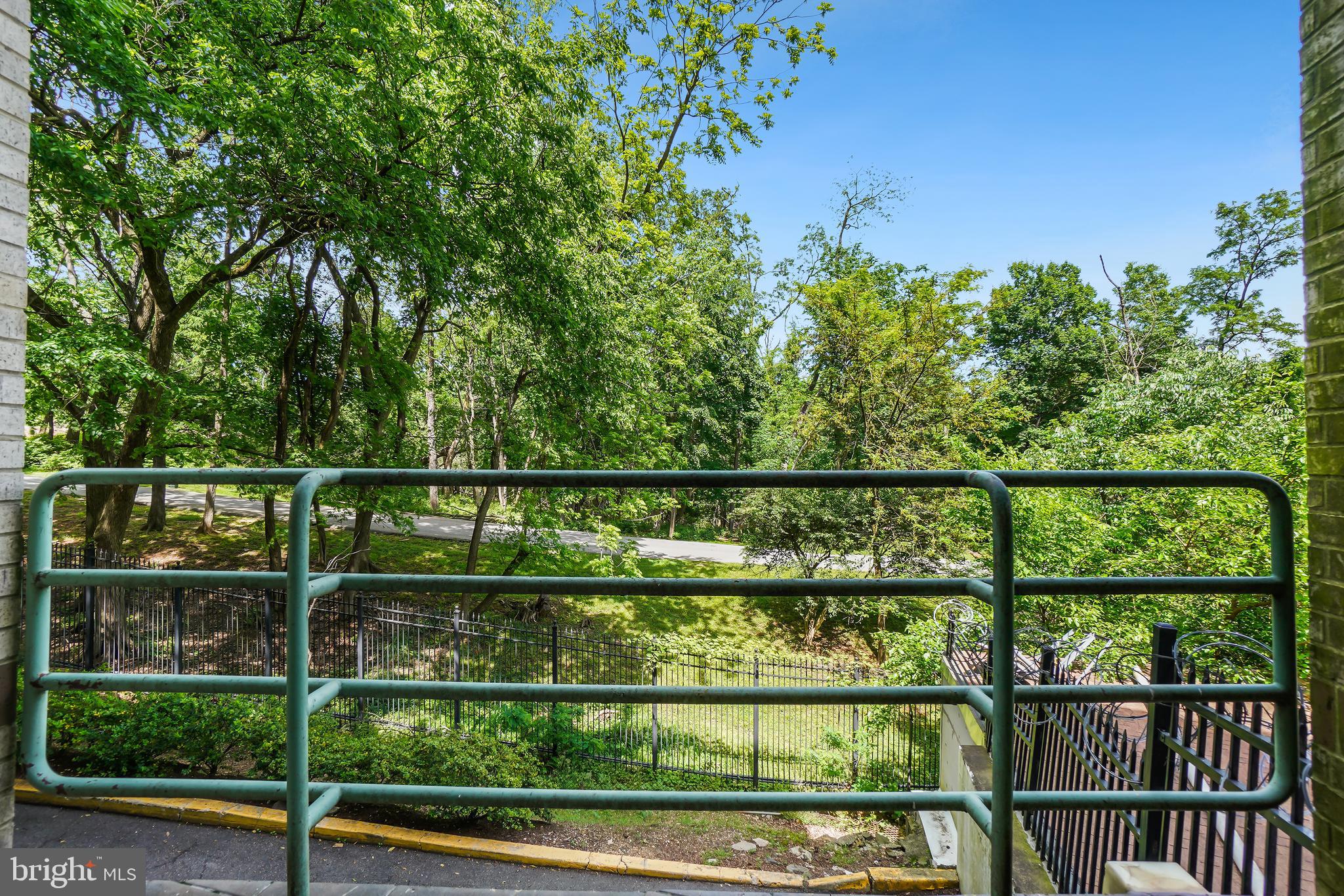 2141 Wisconsin Avenue Northwest, Unit 103 Washington, DC 20007 - Photo 26 of 30 a view of a fence from a balcony