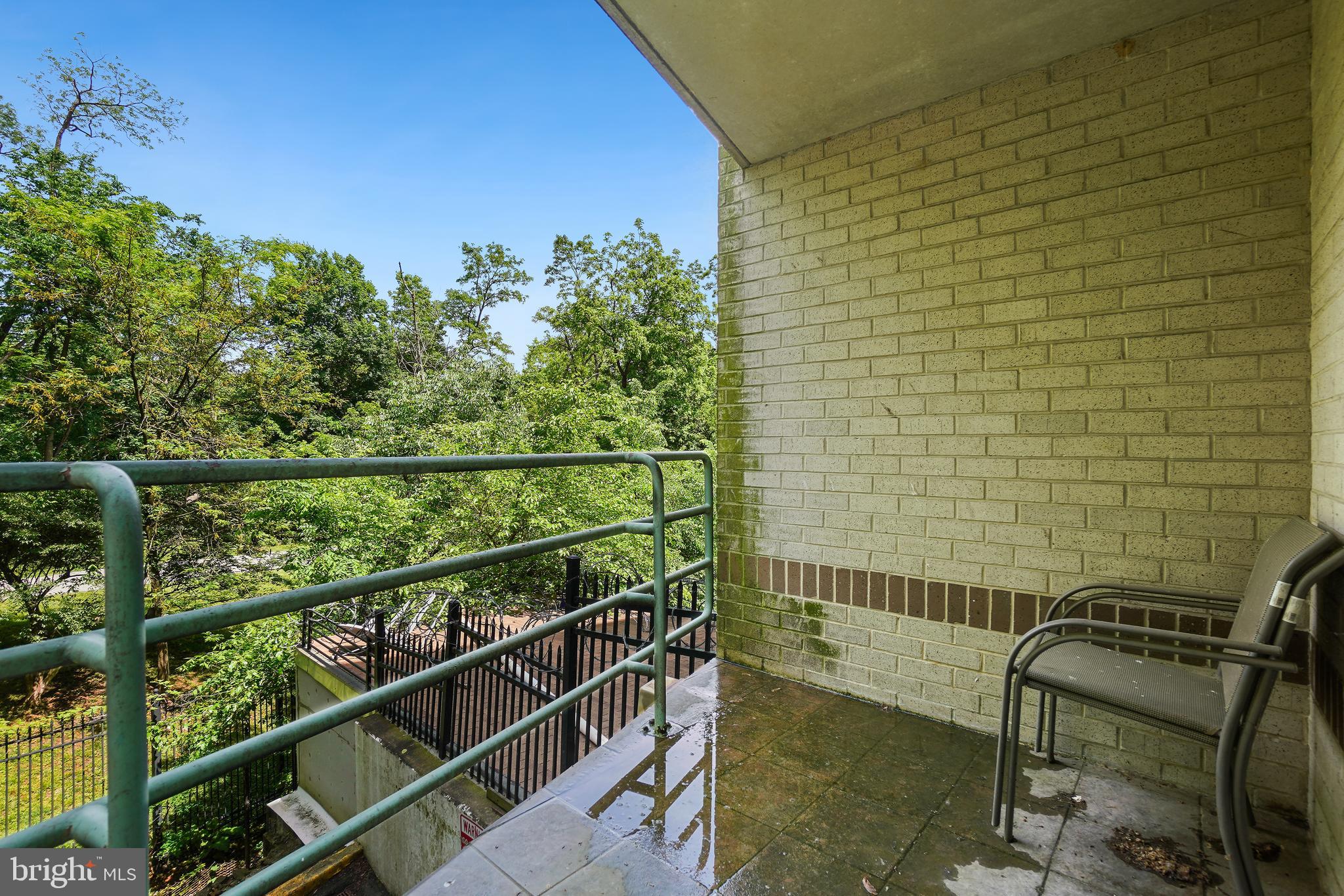 2141 Wisconsin Avenue Northwest, Unit 103 Washington, DC 20007 - Photo 27 of 30 a view of a balcony with chairs