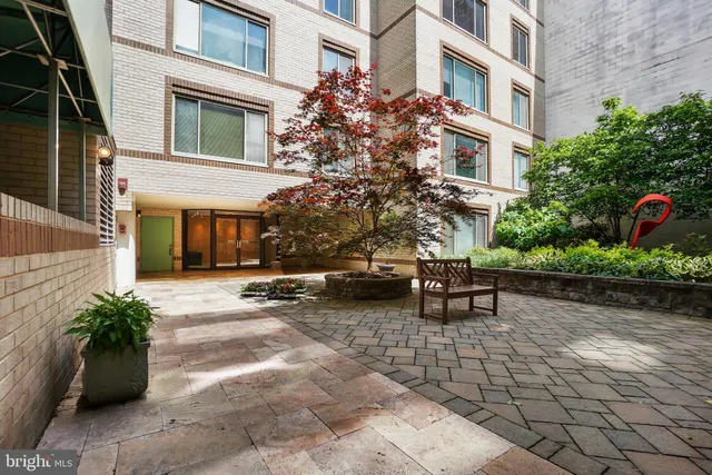 a view of a backyard with sitting area