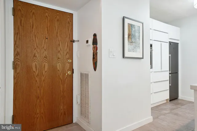 a kitchen with a refrigerator and a sink