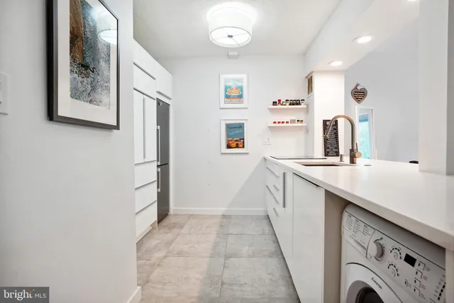 a view of living room with granite countertop furniture and a fireplace