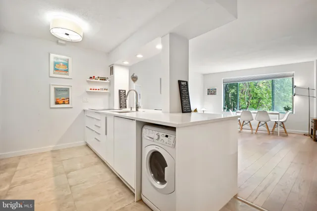 a kitchen with stainless steel appliances and cabinets