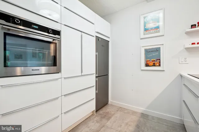 a kitchen with counter top and sink