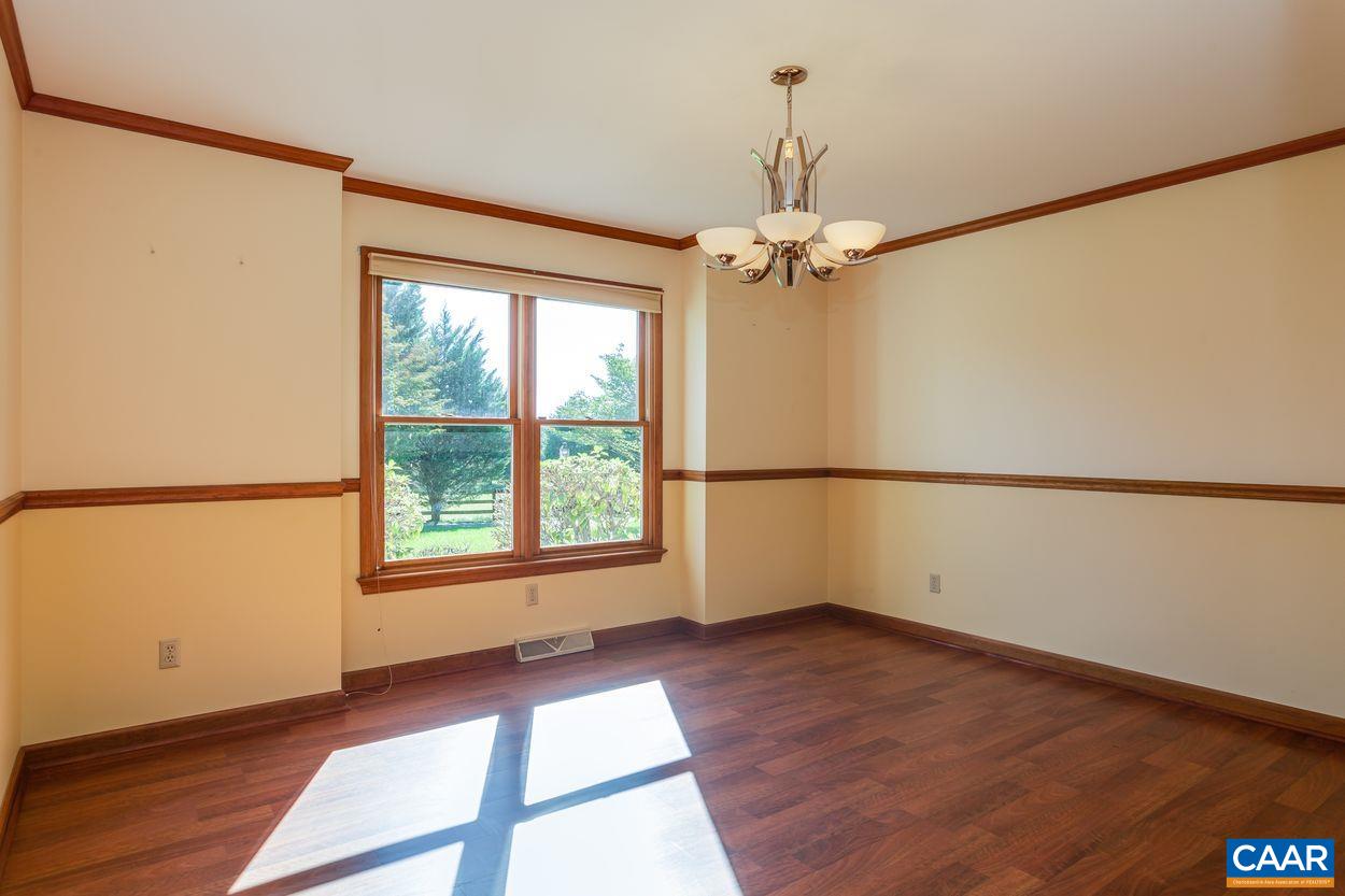 5904 Free Union Road Free Union, VA 22940 - Photo 13 of 75 an empty room with wooden floor fan and windows