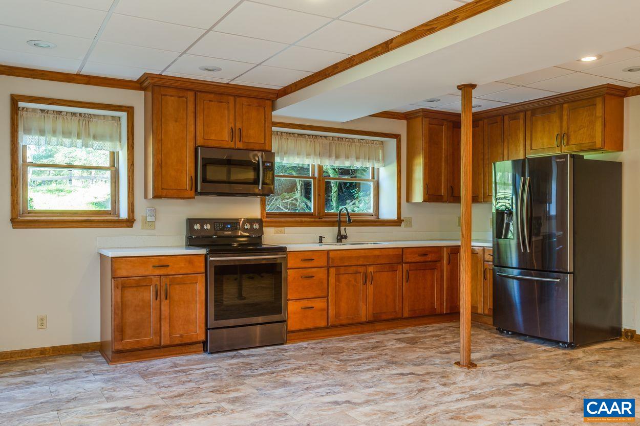 5904 Free Union Road Free Union, VA 22940 - Photo 33 of 75 a kitchen with stainless steel appliances granite countertop a refrigerator stove and sink