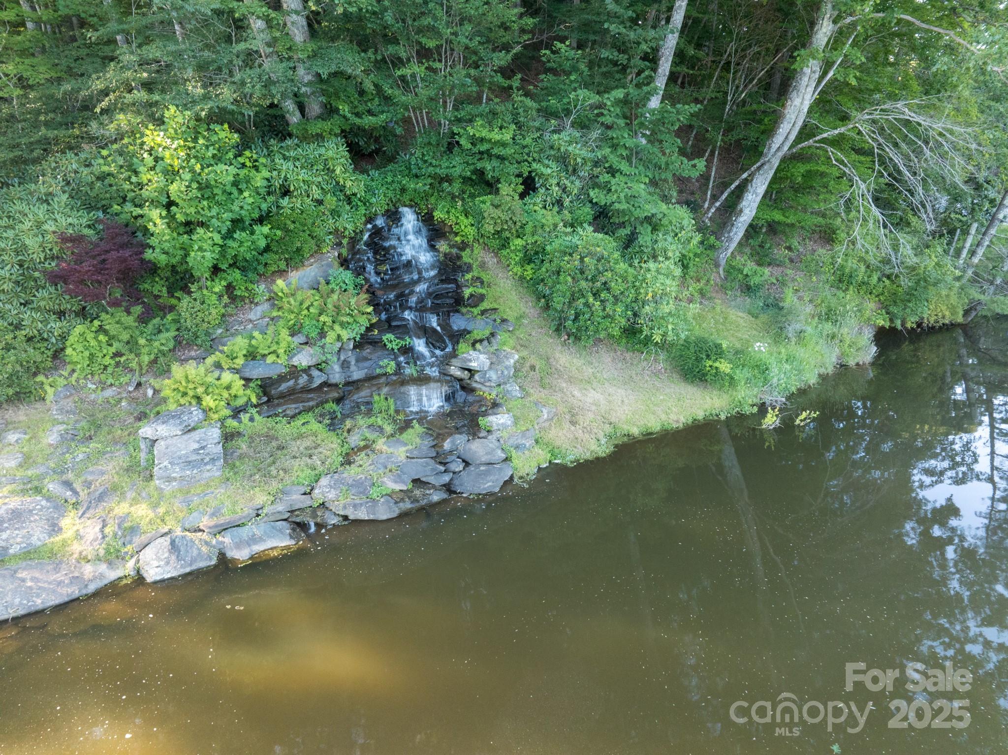 33 Summit Lane Newland, NC 28657 - Photo 12 of 48 a view of a lake from a yard