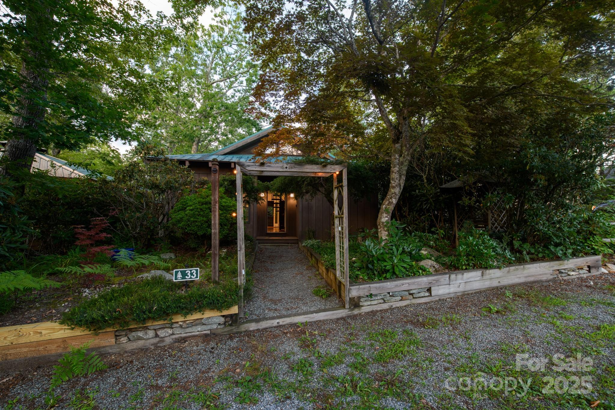 33 Summit Lane Newland, NC 28657 - Photo 19 of 48 a front view of a house with garden