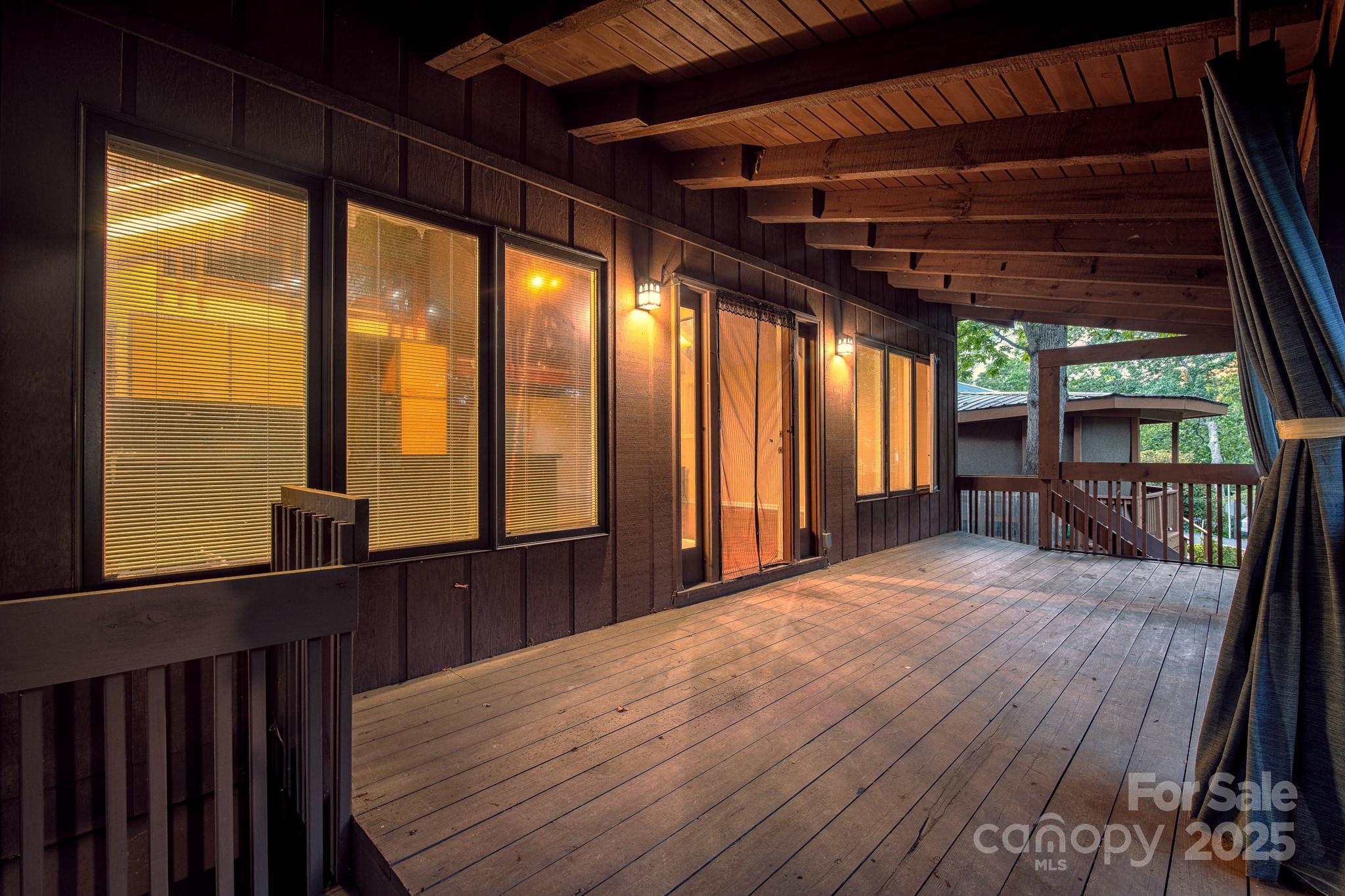 33 Summit Lane Newland, NC 28657 - Photo 23 of 48 a view of a porch with wooden floor