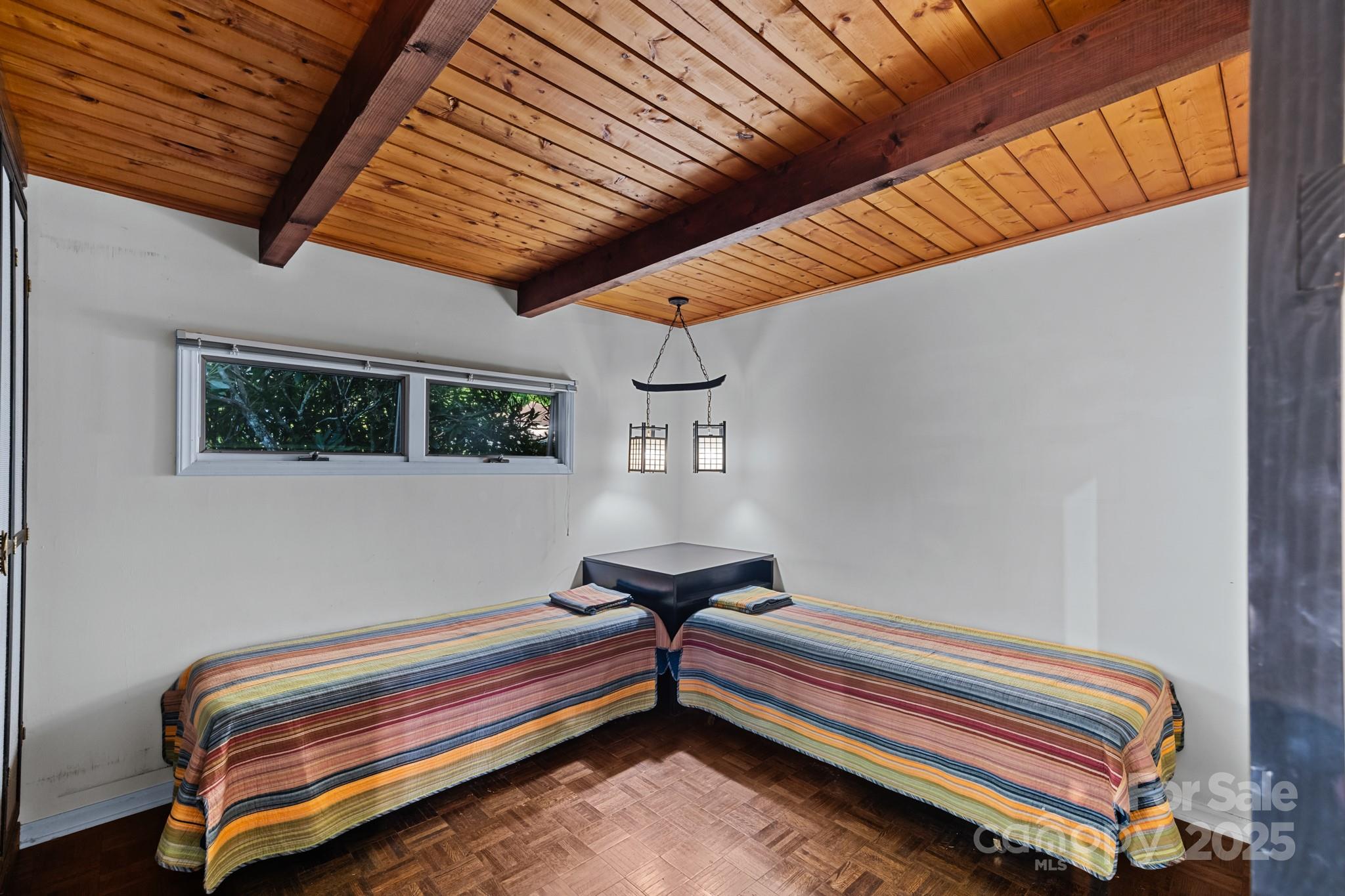 33 Summit Lane Newland, NC 28657 - Photo 31 of 48 a bedroom with furniture and wooden floor